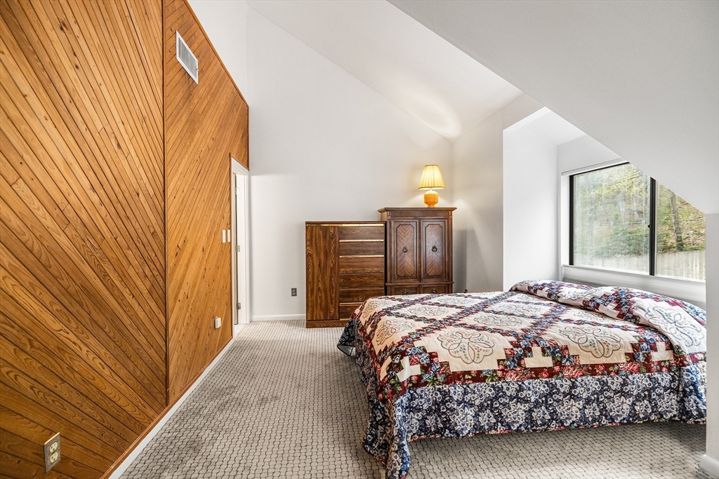 370 Great Road, Unit 8 Acton, MA 01720 - Photo 20 of 27 a bedroom with a bed dresser and a window
