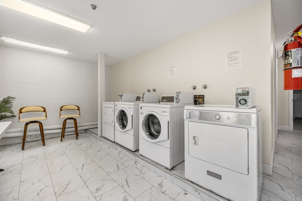 370 Great Road, Unit 8 Acton, MA 01720 - Photo 22 of 27 a utility room with dryer and washer