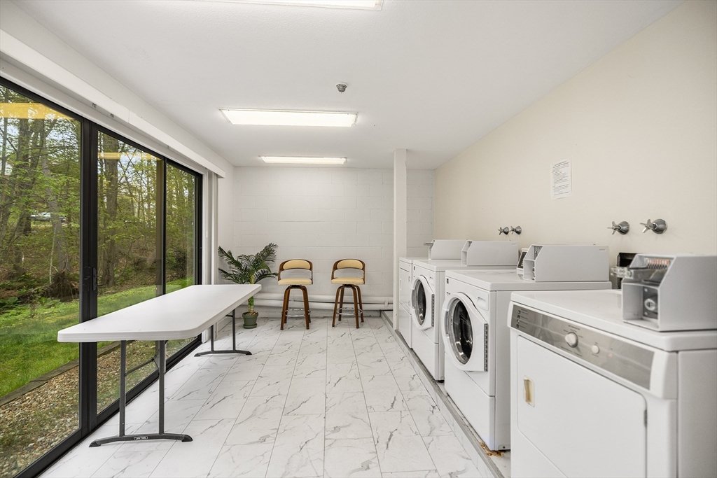 370 Great Road, Unit 8 Acton, MA 01720 - Photo 23 of 27 a room with a washing machine and a sink