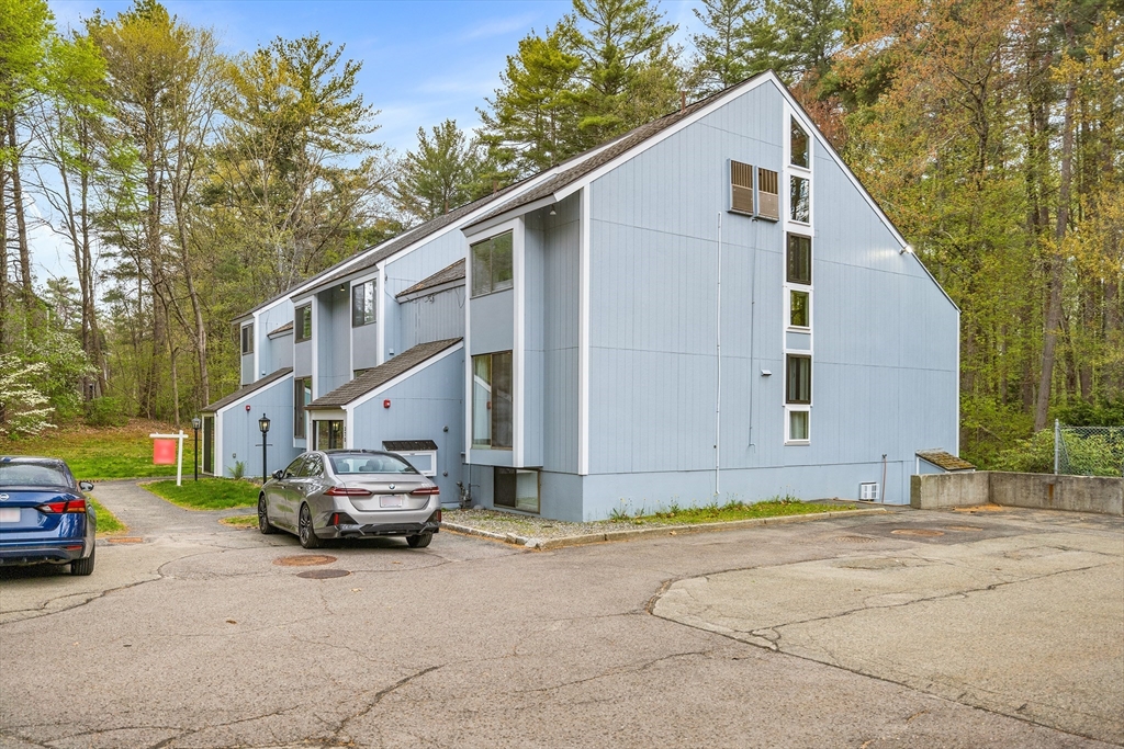 370 Great Road, Unit 8 Acton, MA 01720 - Photo 25 of 27 a car parked in front of a house
