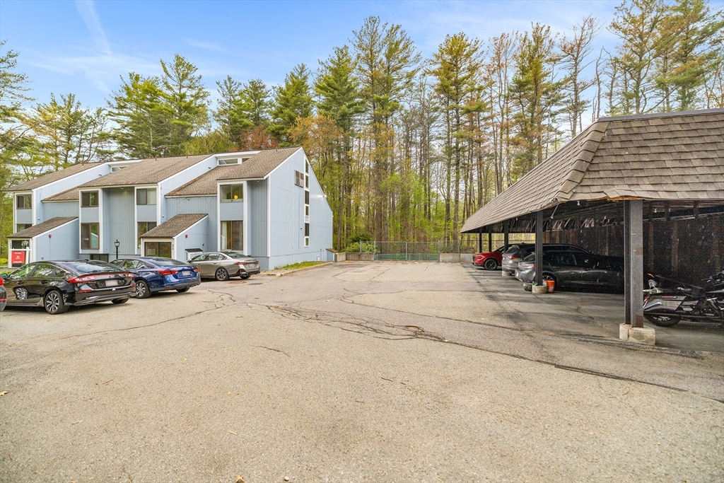 370 Great Road, Unit 8 Acton, MA 01720 - Photo 26 of 27 a view of a house with a patio