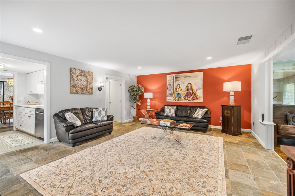 370 Great Road, Unit 8 Acton, MA 01720 - Photo 5 of 27 a living room with furniture and a flat screen tv