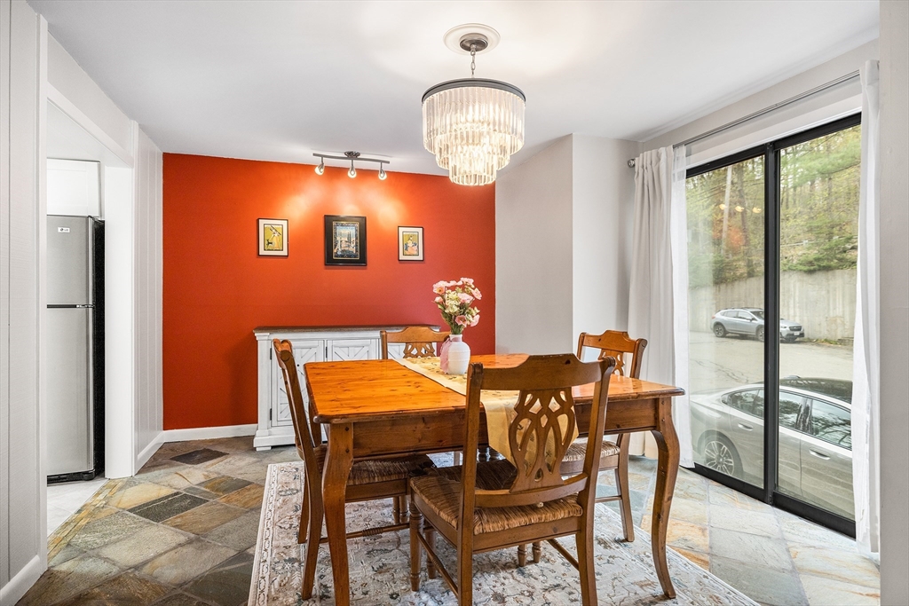 370 Great Road, Unit 8 Acton, MA 01720 - Photo 6 of 27 a dining room with furniture and wooden floor