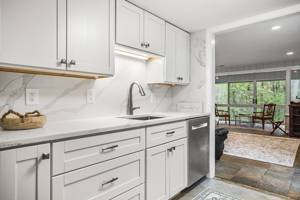 370 Great Road, Unit 8 Acton, MA 01720 - Photo 10 of 27 a kitchen with appliances cabinets and a counter top space