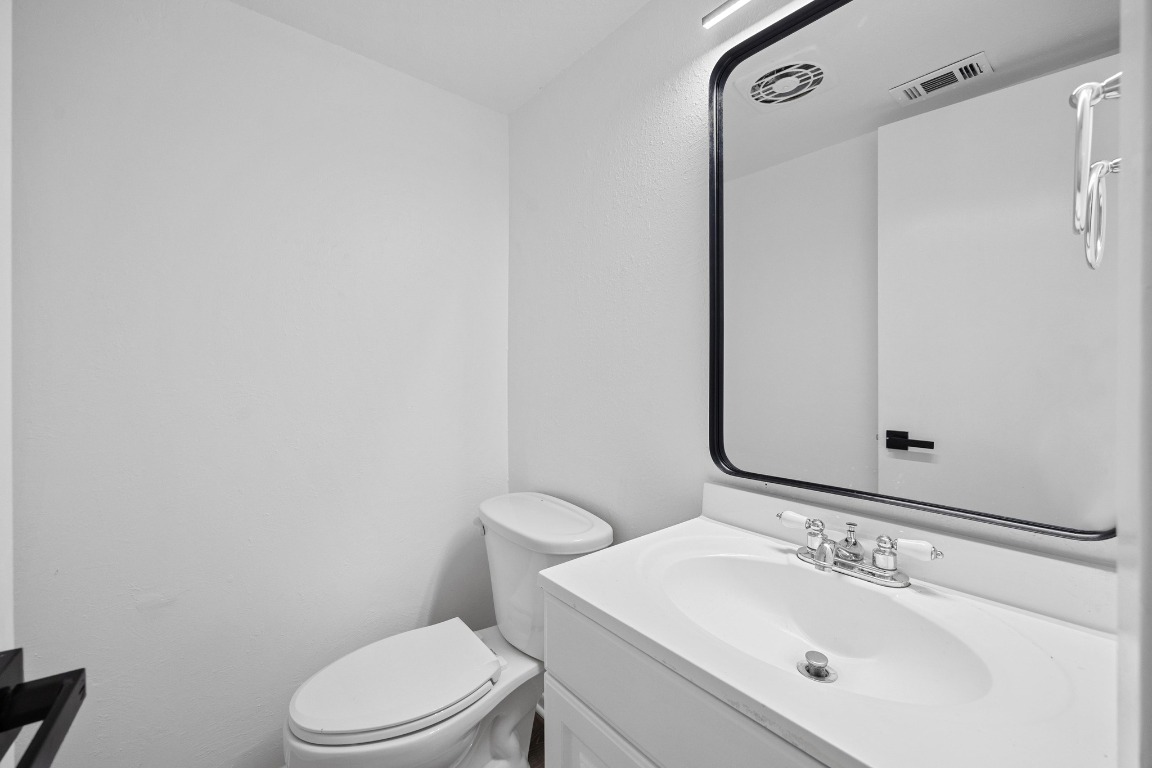 5211 Thunderbird Street, Unit A Lago Vista, TX 78645 - Photo 11 of 26 a bathroom with a sink toilet and shower