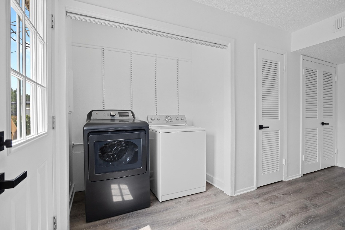 5211 Thunderbird Street, Unit A Lago Vista, TX 78645 - Photo 16 of 26 a utility room with dryer and washer