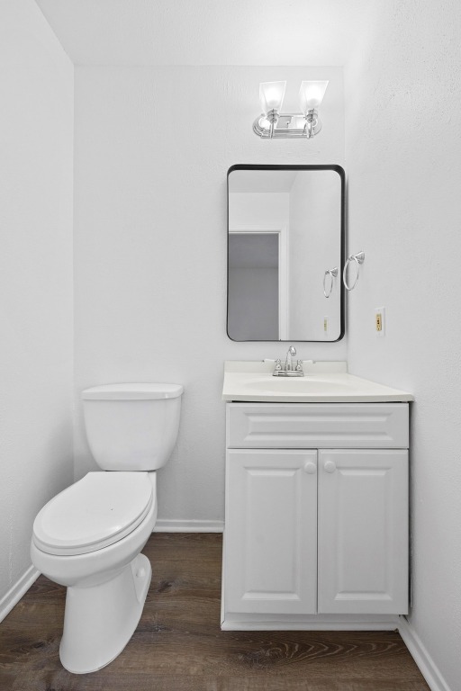 5211 Thunderbird Street, Unit A Lago Vista, TX 78645 - Photo 19 of 26 a bathroom with a toilet a sink and mirror