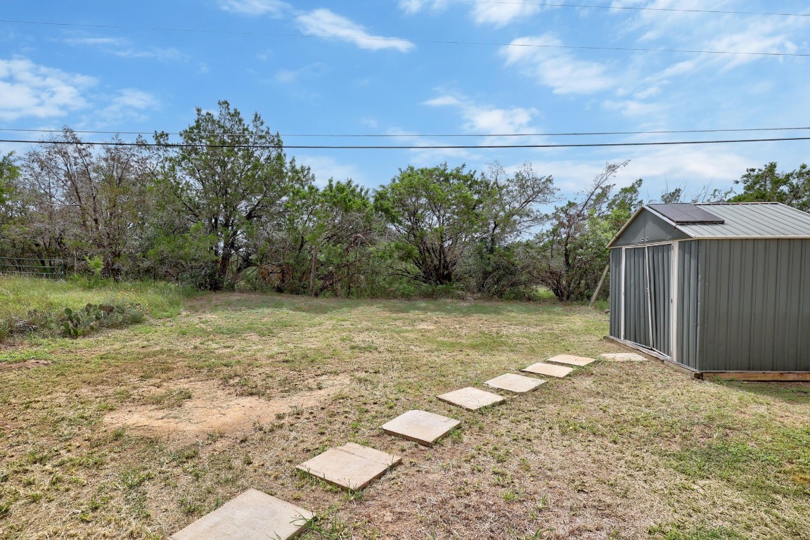 5211 Thunderbird Street, Unit A Lago Vista, TX 78645 - Photo 24 of 26 a view of a backyard