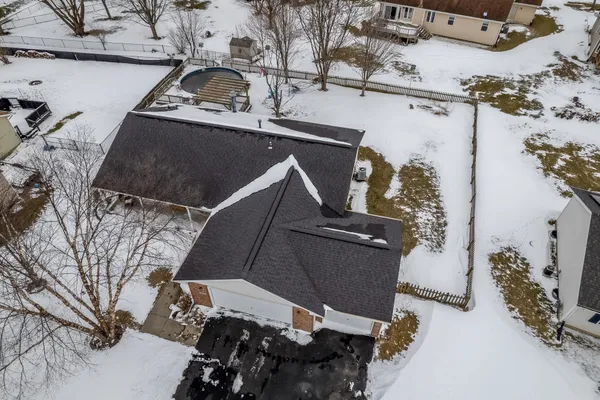 an aerial view of a fireplace with wooden fence