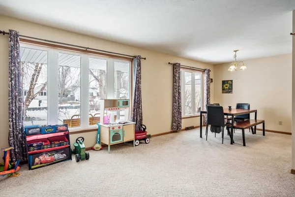a view of a dining room with furniture window and outside view