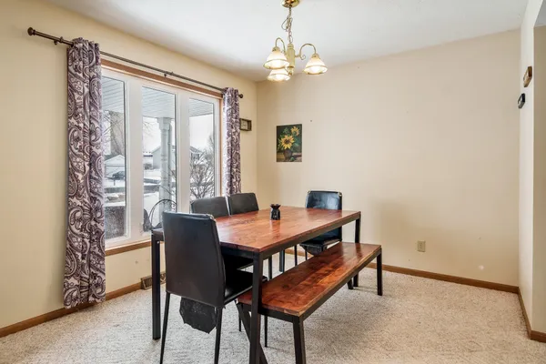 a view of a kitchen counter top space with a sink furniture and a window
