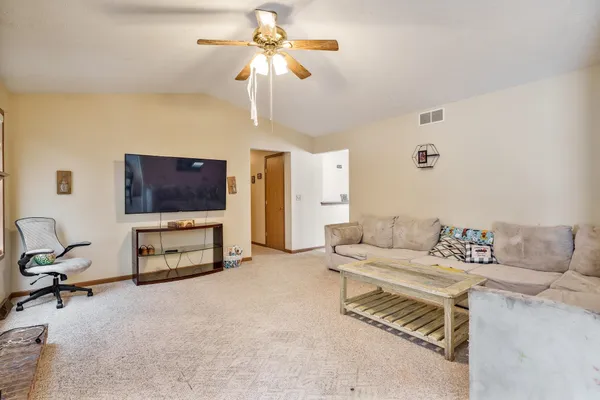 a living room with a fireplace and a window