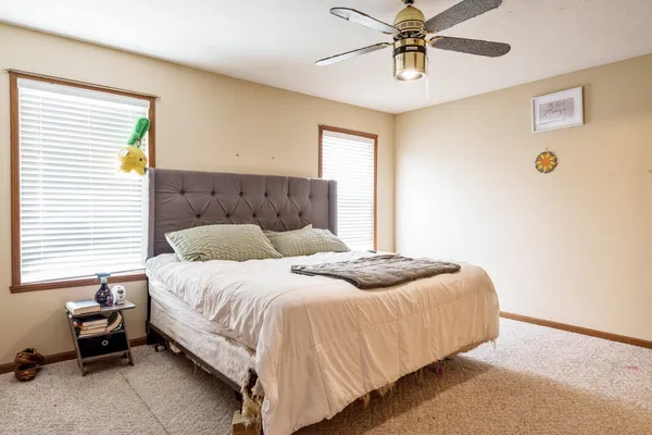 a bedroom with furniture and a window