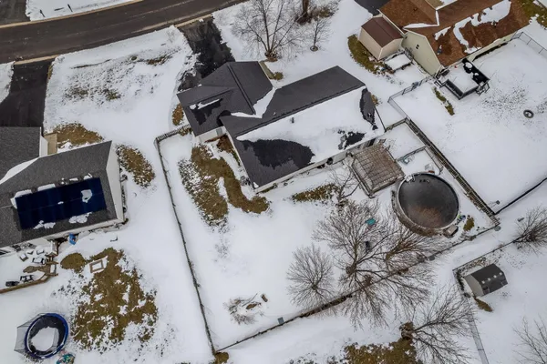 an aerial view of a building with parking space