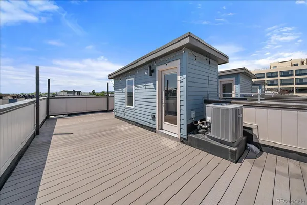a view of a terrace with wooden floor and seating space