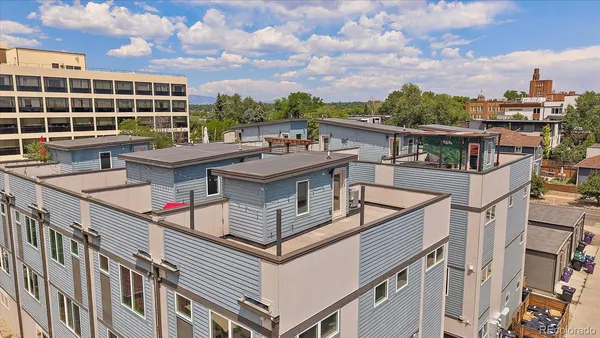 a view of a white building from a balcony
