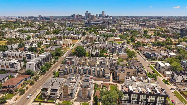 an aerial view of residential building with parking