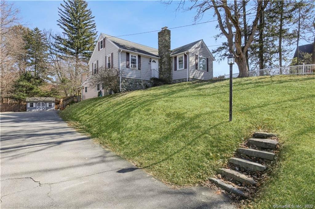 158 Broad Street Killingly, CT 06239 - Photo 1 of 1 a view of a white house with a big yard and large trees