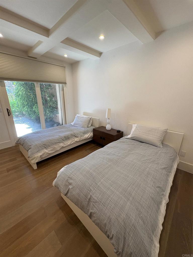 1317 Caminito Balada La Jolla, CA 92037 - Photo 13 of 16 a bedroom with two beds and window