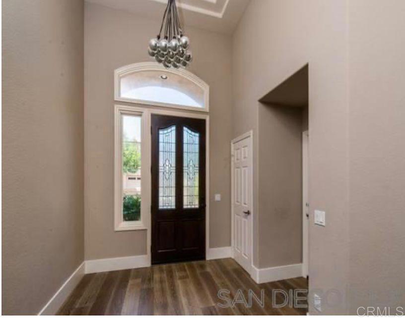1317 Caminito Balada La Jolla, CA 92037 - Photo 3 of 16 a view of a hallway with windows and chandelier