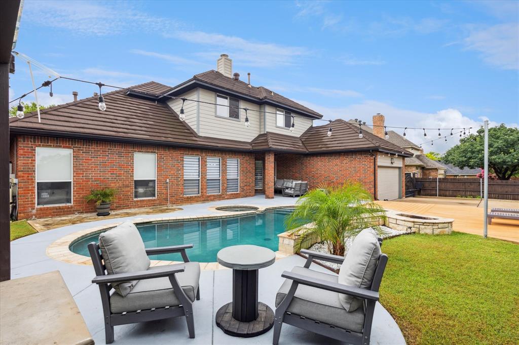 a front view of a house with garden and porch