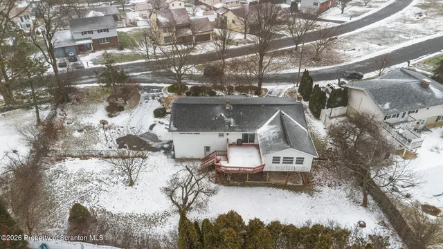 a roof deck view with a sitting space