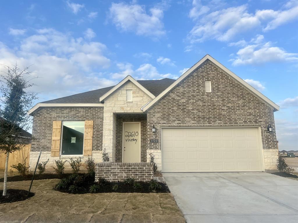 11110 Swamp Edge Lane Cypress, TX 77433 - Photo 1 of 36 a front view of a house with garden