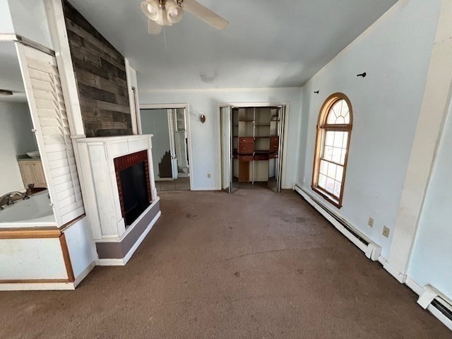 399 Main Street Oxford, MA 01540 - Photo 16 of 28 a view of an empty room with a fireplace and a window