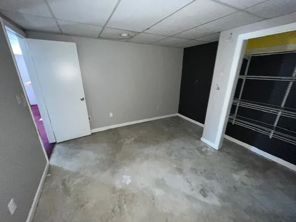 a view of an empty room with a fireplace