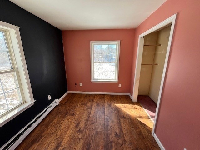 399 Main Street Oxford, MA 01540 - Photo 7 of 28 wooden floor in an empty room with a window