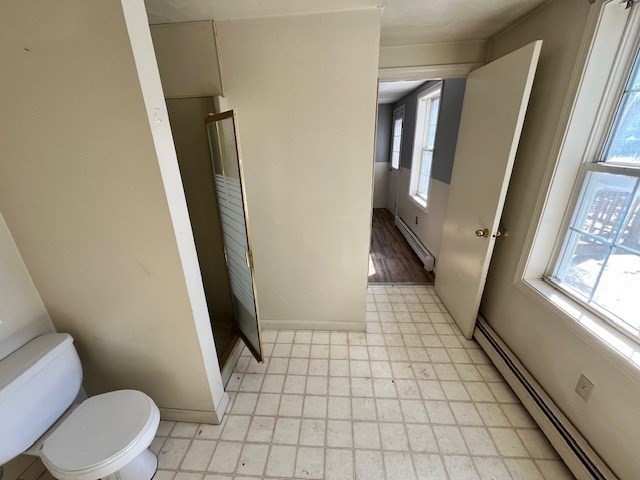 399 Main Street Oxford, MA 01540 - Photo 9 of 28 a bathroom with a toilet and a shower