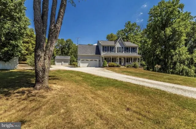 a view of swimming pool with outdoor seating and trees