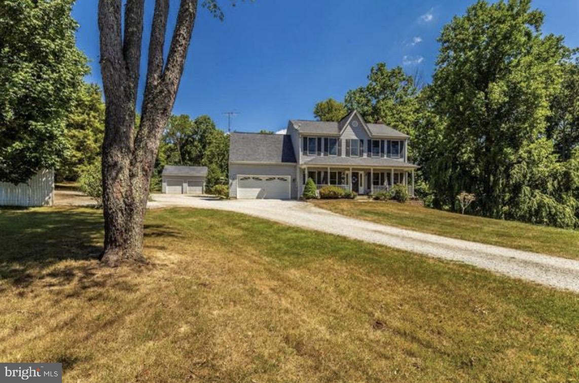 a view of swimming pool with outdoor seating and trees