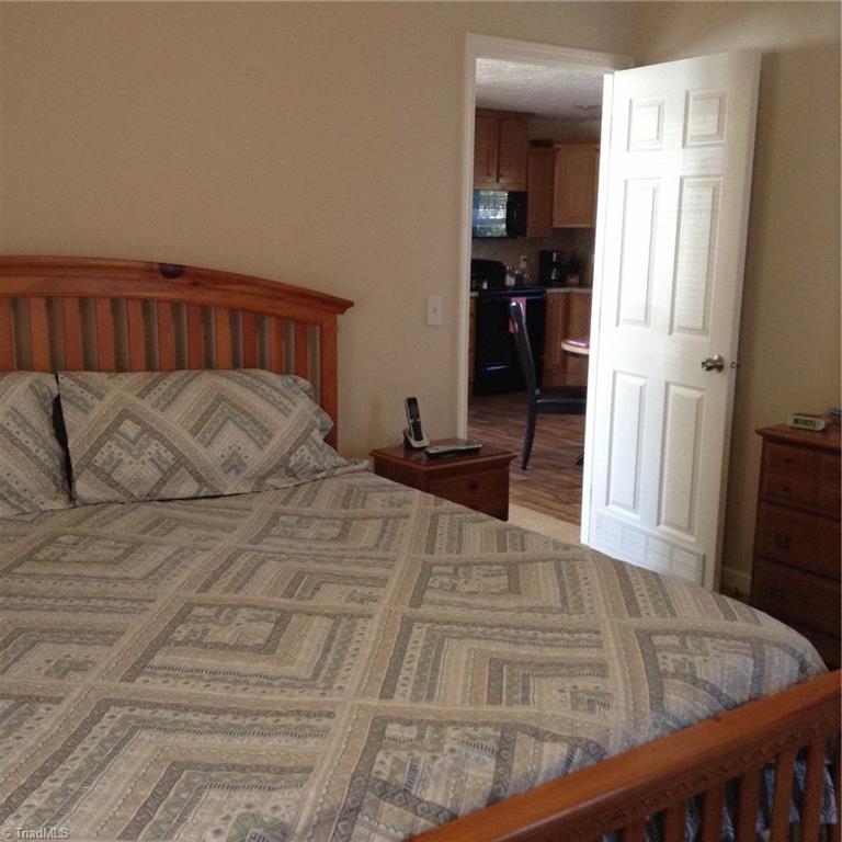 2716 Prison Camp Road Dobson, NC 27017 - Photo 13 of 21 Master bedroom- leads out into living room and kitchen area