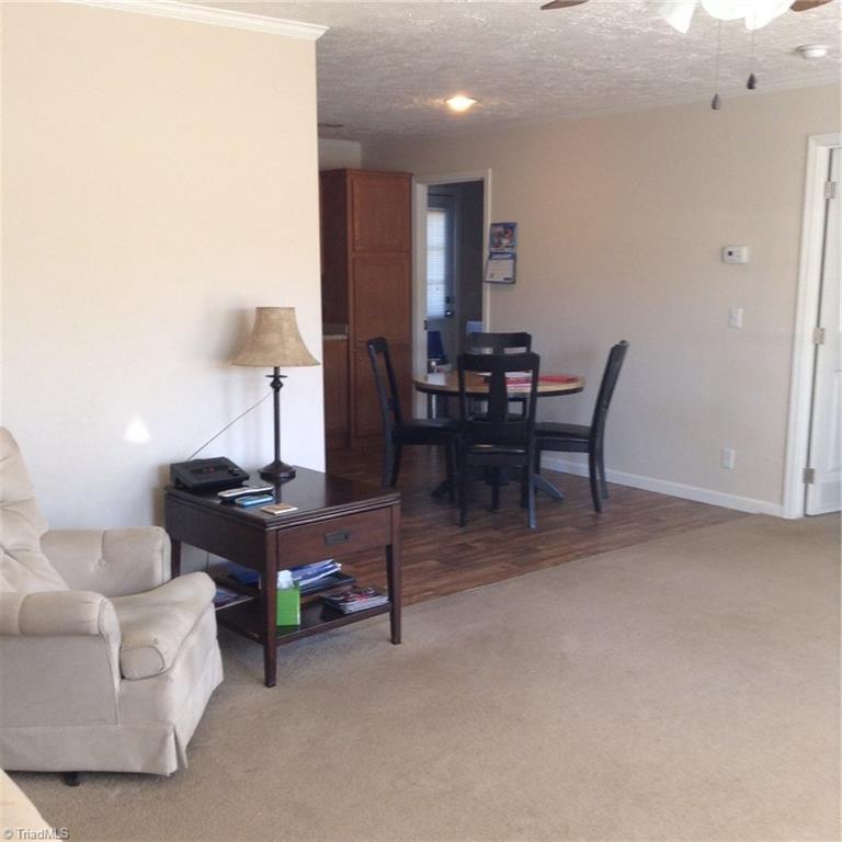 2716 Prison Camp Road Dobson, NC 27017 - Photo 20 of 21 Living room looking into kitchen area