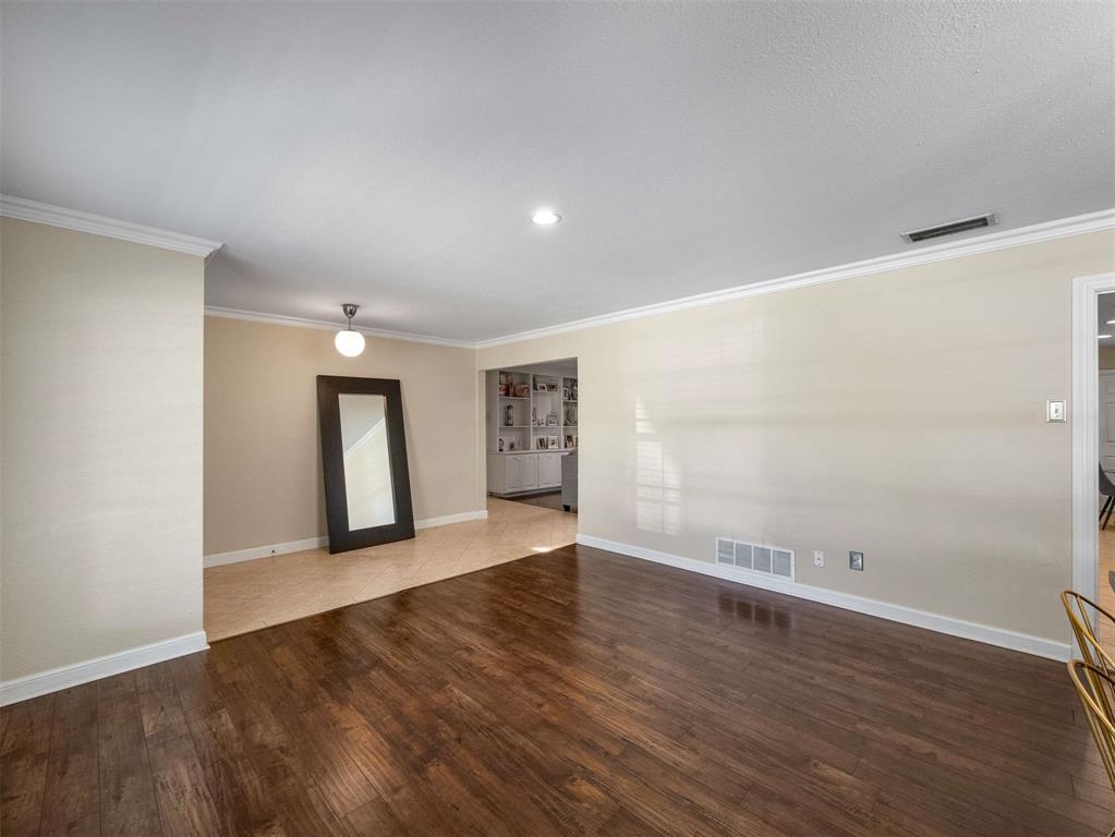 3750 Ridgeoak Way Farmers Branch, TX 75244 - Photo 12 of 30 a view of an empty room with wooden floor and a window