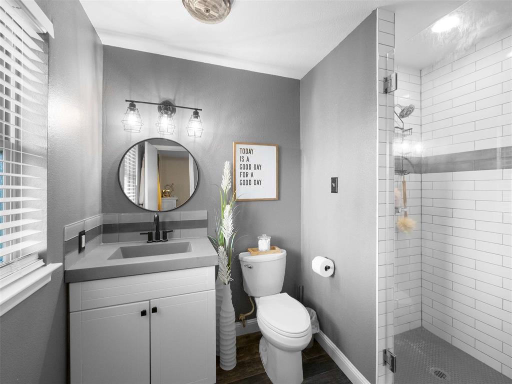 3750 Ridgeoak Way Farmers Branch, TX 75244 - Photo 18 of 30 a bathroom with a toilet sink vanity granite and mirror