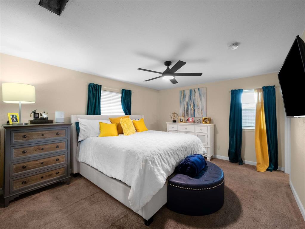 3750 Ridgeoak Way Farmers Branch, TX 75244 - Photo 21 of 30 a bedroom with a bed and a dresser