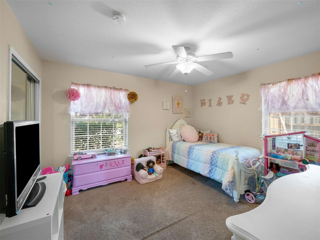 3750 Ridgeoak Way Farmers Branch, TX 75244 - Photo 22 of 30 a bedroom with furniture and a large window