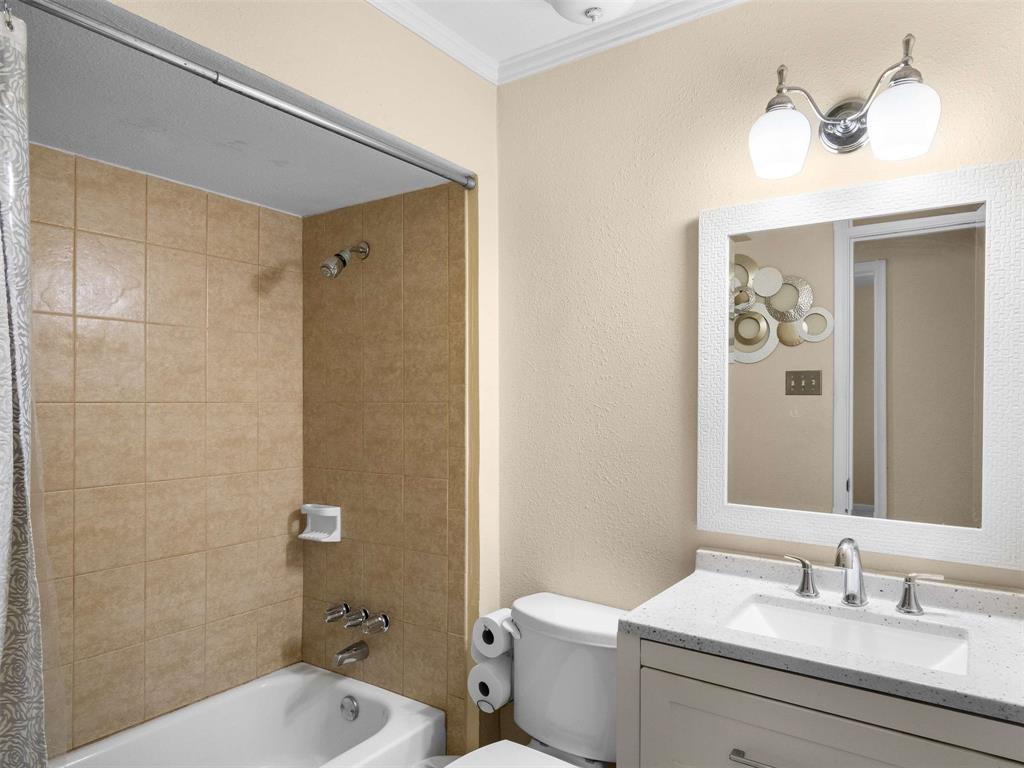 3750 Ridgeoak Way Farmers Branch, TX 75244 - Photo 23 of 30 a bathroom with a sink a toilet and shower