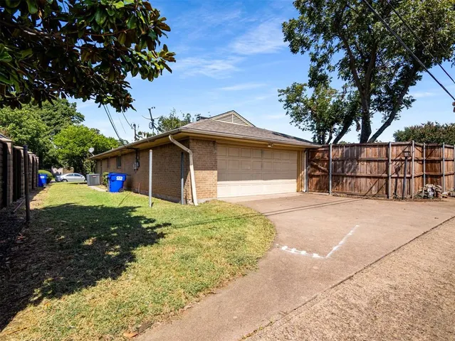 a front view of a house with a yard garage and outdoor seating