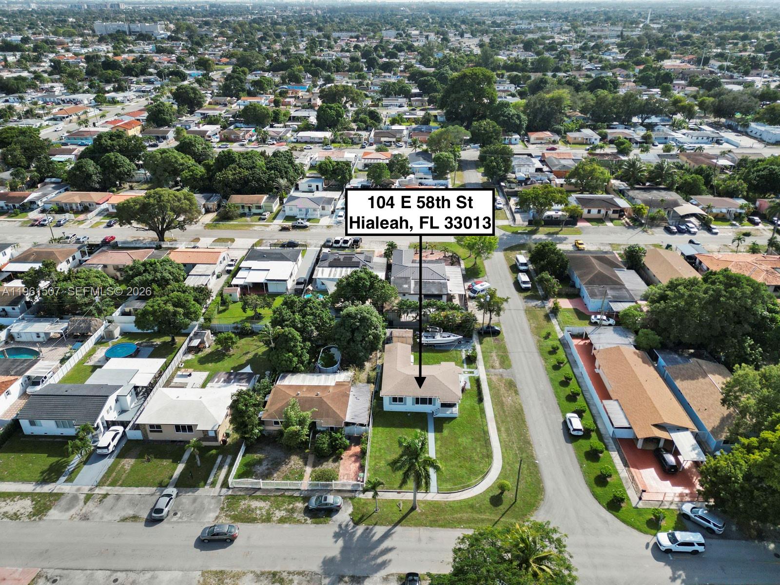 104 East 58th Street, Unit 1 Hialeah, FL 33013 - Photo 6 of 33 an aerial view of residential houses with outdoor space and parking