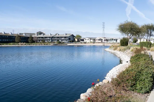 an aerial view of a house with a lake view