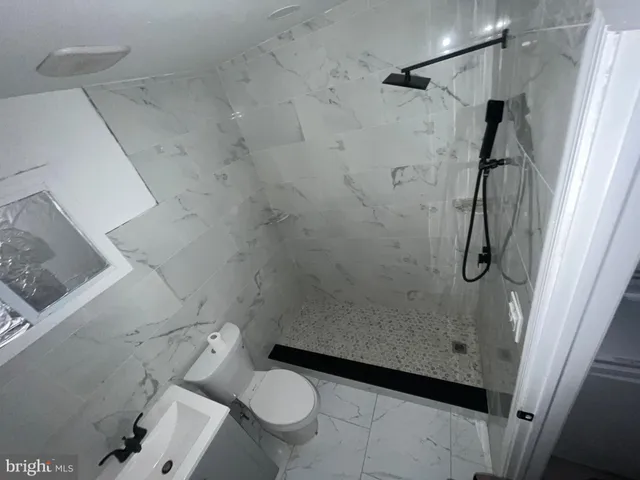 a kitchen with a refrigerator a stove top oven a sink and dishwasher