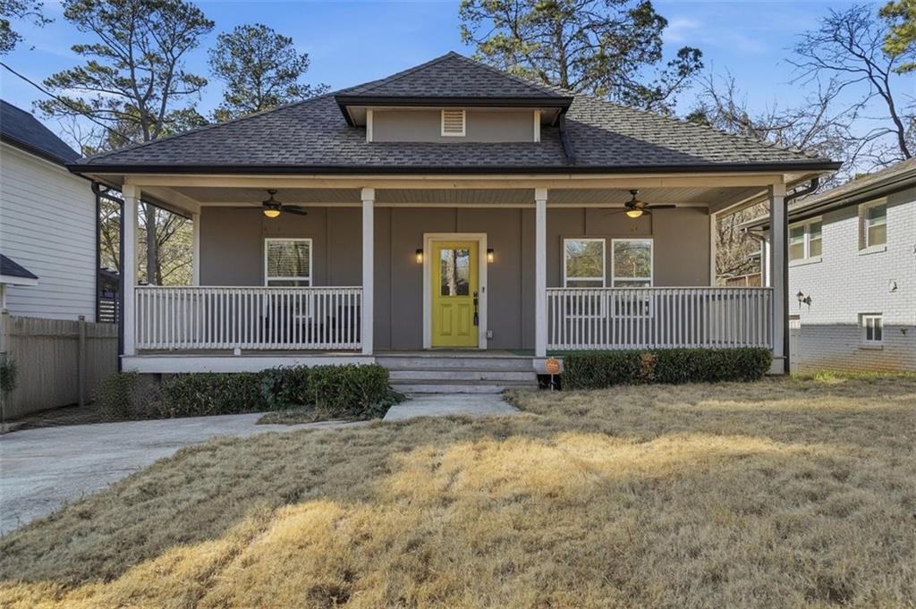 a view of a house with a small yard and plants