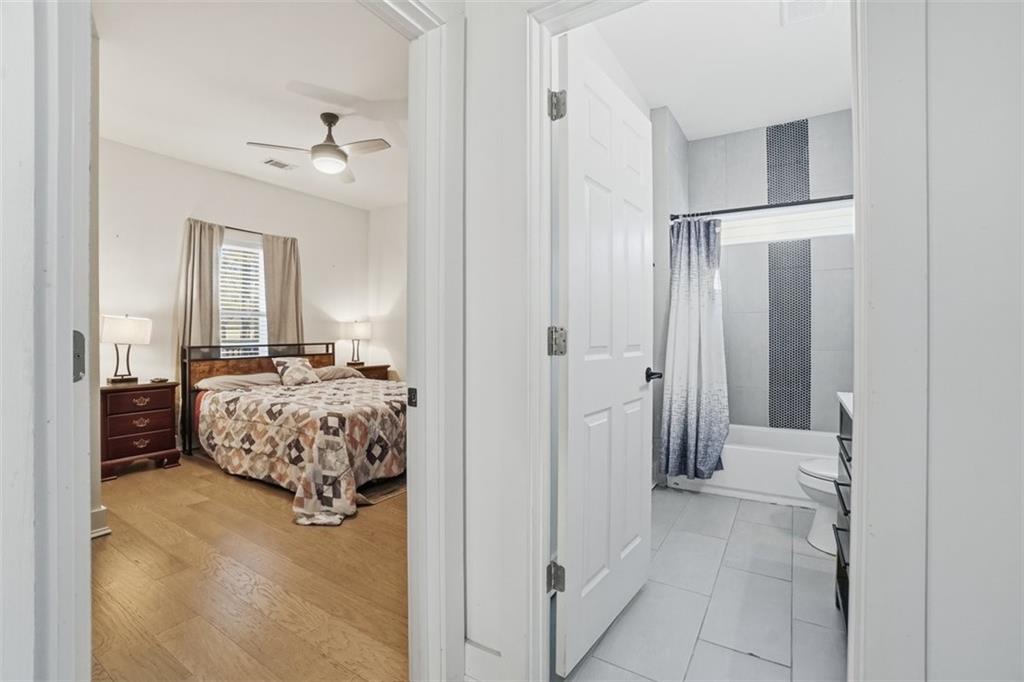 2281 Pryor Road Southwest Atlanta, GA 30315 - Photo 16 of 32 a bedroom with a bed and a chandelier