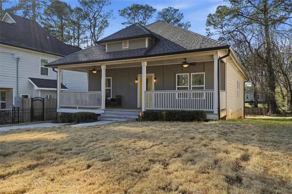 2281 Pryor Road Southwest Atlanta, GA 30315 - Photo 2 of 32 a front view of a house with a yard and garage