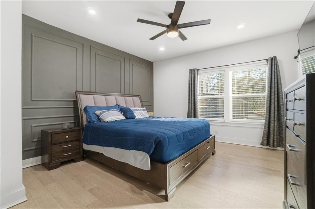 2281 Pryor Road Southwest Atlanta, GA 30315 - Photo 22 of 32 a spacious bedroom with a bed and a window