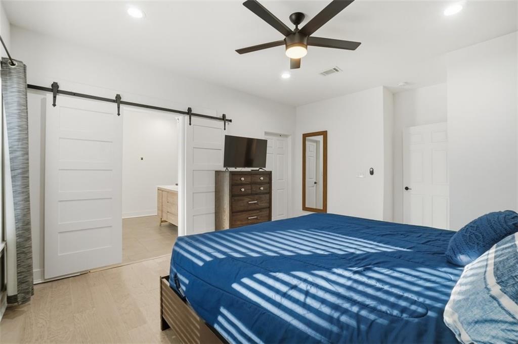 2281 Pryor Road Southwest Atlanta, GA 30315 - Photo 23 of 32 a bedroom with a bed and a view of kitchen