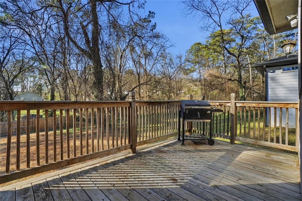 2281 Pryor Road Southwest Atlanta, GA 30315 - Photo 28 of 32 a view of a balcony with wooden floor and fence